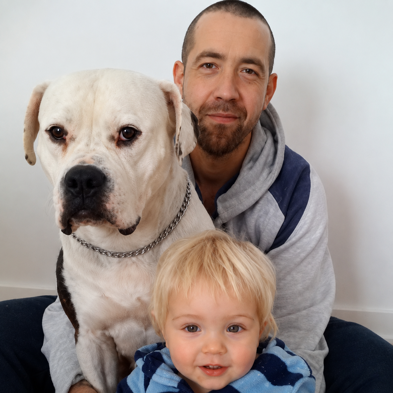 Fred, owner and experienced trainer at North Toronto K9 Center, with his family and dog